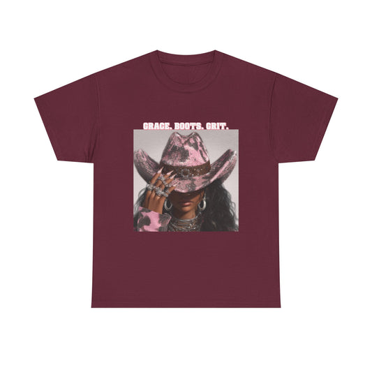 Maroon t-shirt with graphic of a person wearing a cowboy hat and text 'GRACE, BOOTS, Grit' on a white background