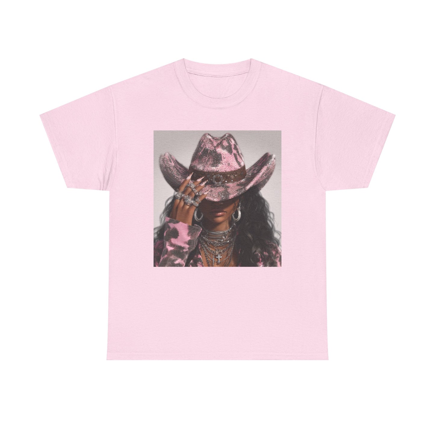 Pink t-shirt with a graphic of a person wearing a cowboy hat on a white background