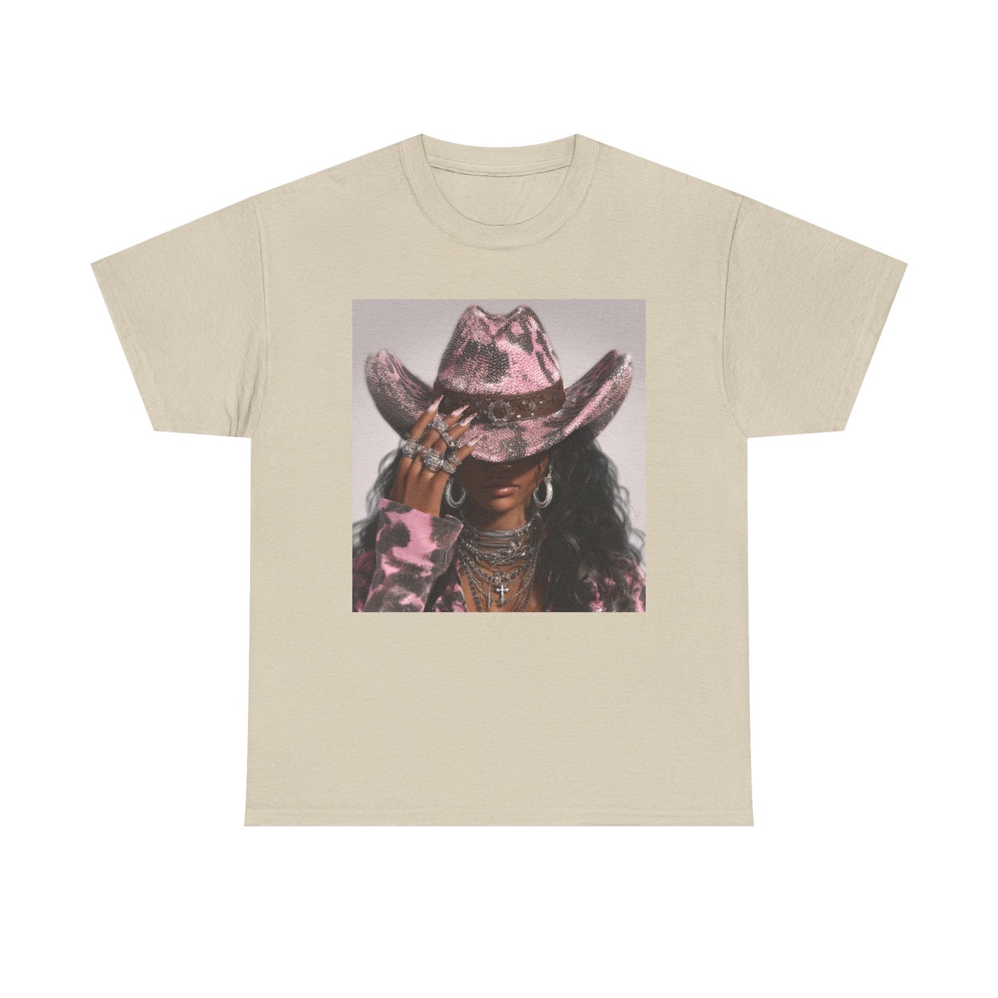 Beige t-shirt with a graphic of a person wearing a pink cowboy hat on a white background