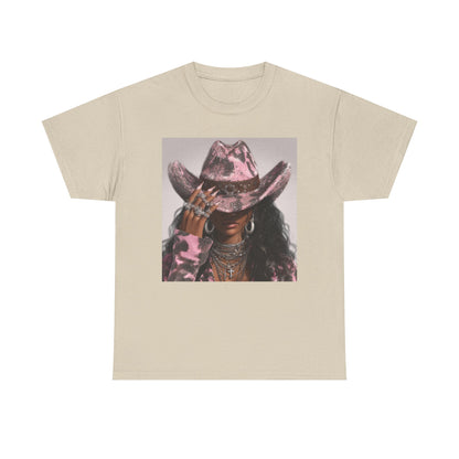 Beige t-shirt with a graphic of a person wearing a pink cowboy hat on a white background