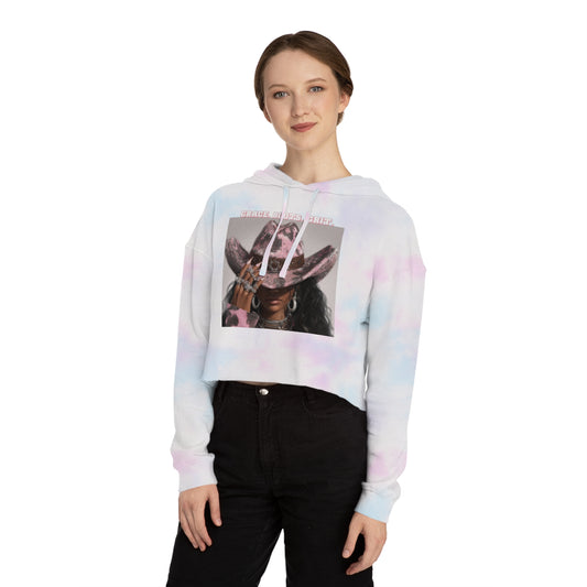 Person wearing a tie-dye hoodie with a graphic design on a white background